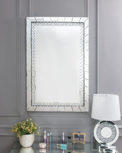 Sophisticated, graceful and elegant, the Nysa wall mirror demonstrates style and restraint with its unique design. While elegantly reflecting its surroundings, the Nysa combines glamour with modernism. Light is captured and reflected from all surfaces of 