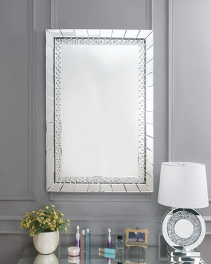 Sophisticated, graceful and elegant, the Nysa wall mirror demonstrates style and restraint with its unique design. While elegantly reflecting its surroundings, the Nysa combines glamour with modernism. Light is captured and reflected from all surfaces of 
