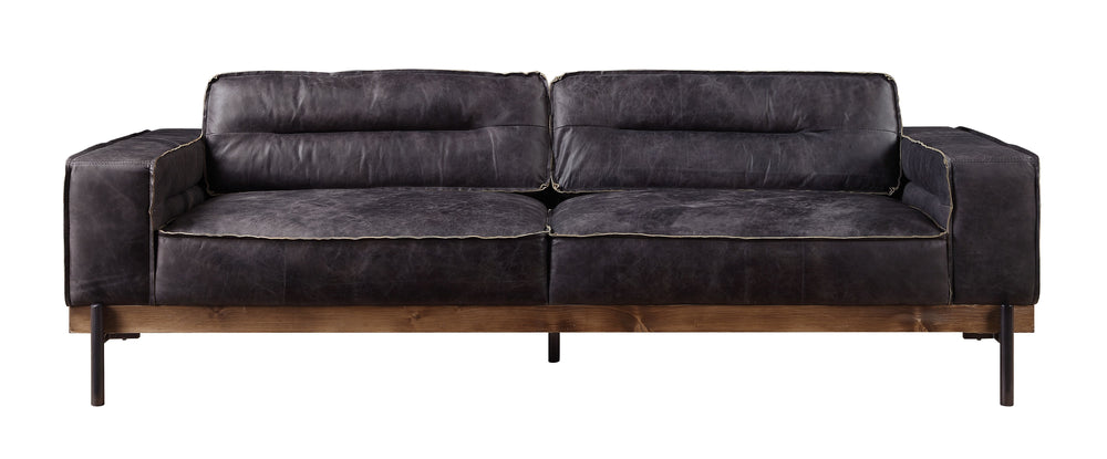 Part of the handsome Silchester Collection, this modern industrial sofa set will look great in any contemporary space. Contrast stitching makes the antique ebony top grain leather upholstery pop, and highlights the warm color of the wooden trim base. Meta
