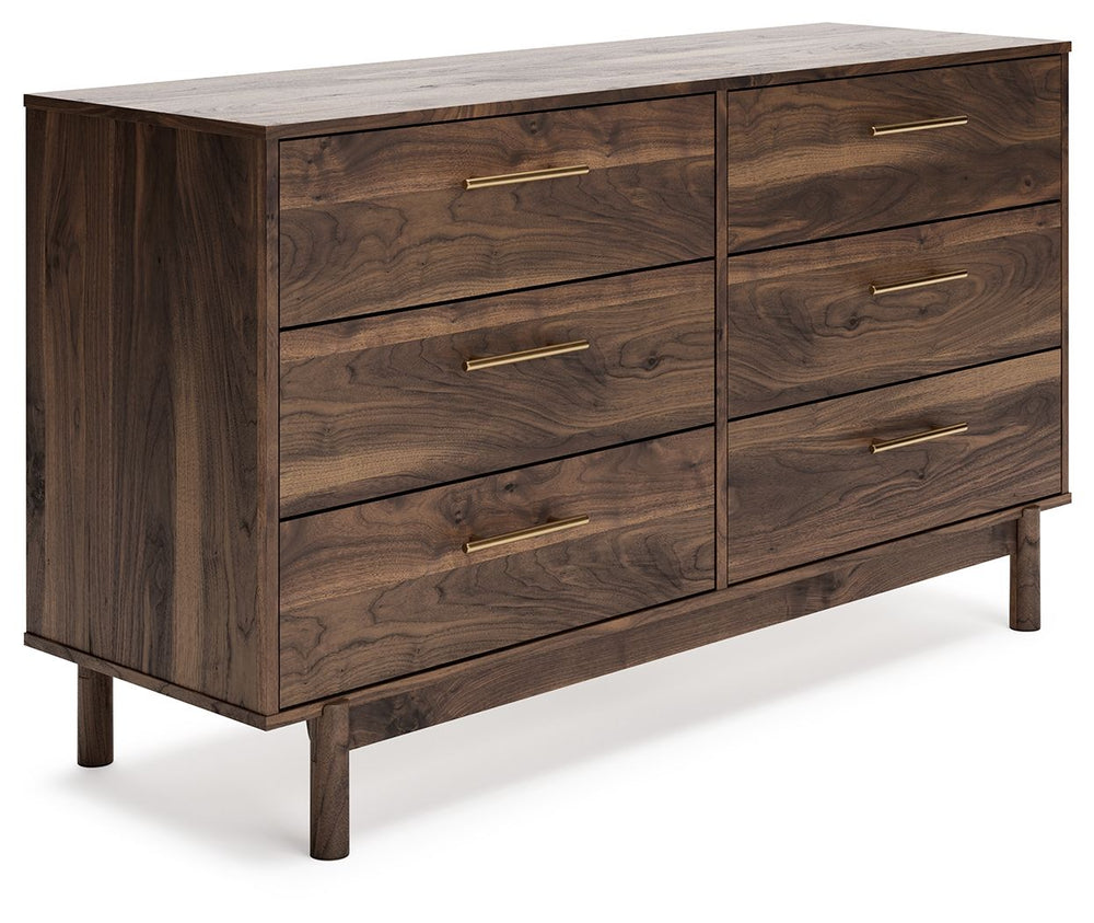 At the intersection of industrial cool and chic sophistication, youâ€™ll find this dresser. With a rich brown finish over replicated walnut wood grain, paired with burnished goldtone handles, it offers an authentic touch that plays well any way you style 