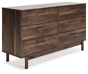 At the intersection of industrial cool and chic sophistication, youâ€™ll find this dresser. With a rich brown finish over replicated walnut wood grain, paired with burnished goldtone handles, it offers an authentic touch that plays well any way you style 