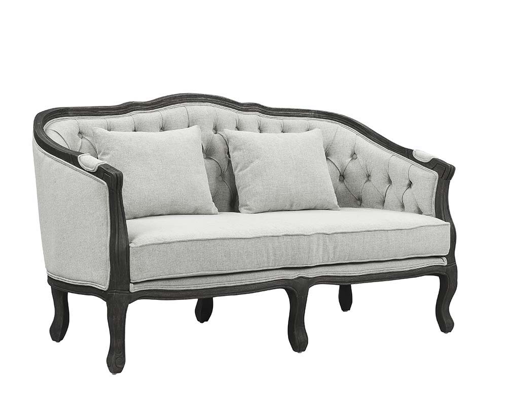 With a nod to vintage French design, the Samael is a modern interpretation of a camel-back sofa is distinguished by its exposed, and beautifully carved, wooden frame that wraps you in comfort. Its curved frame with a winding front rail sits off the floor 