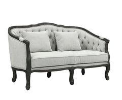 With a nod to vintage French design, the Samael is a modern interpretation of a camel-back sofa is distinguished by its exposed, and beautifully carved, wooden frame that wraps you in comfort. Its curved frame with a winding front rail sits off the floor 