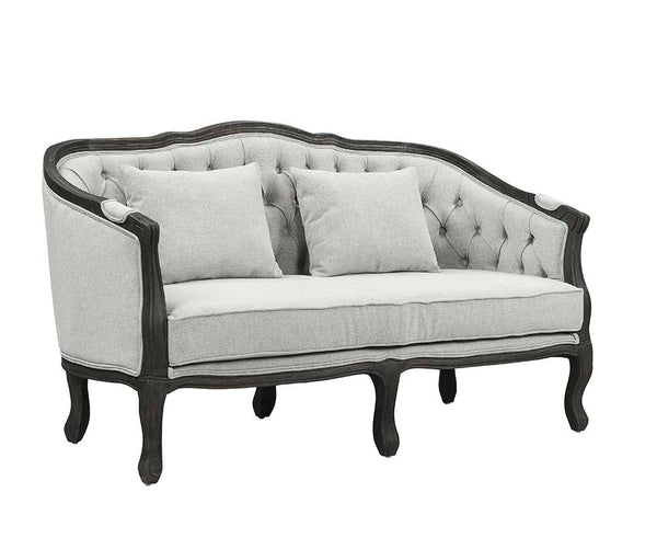 With a nod to vintage French design, the Samael is a modern interpretation of a camel-back sofa is distinguished by its exposed, and beautifully carved, wooden frame that wraps you in comfort. Its curved frame with a winding front rail sits off the floor 