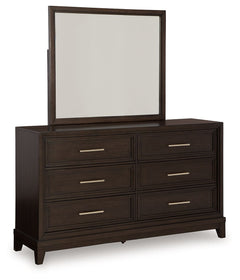 This dresser and mirror set combines modern and art deco styles for both traditional and contemporary arrangements. With elegant stepped moulded framing and ample storage, it adds dimension to your sanctuary while keeping your belongings organized and clu