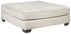 Make room for big-time comfort and style with this oversized ottoman. Designed to multitask as a footrest and casually cool coffee table, this firmly cushioned square ottoman is covered in a decadently soft chenille microfiber thatâ€™s love at first touch