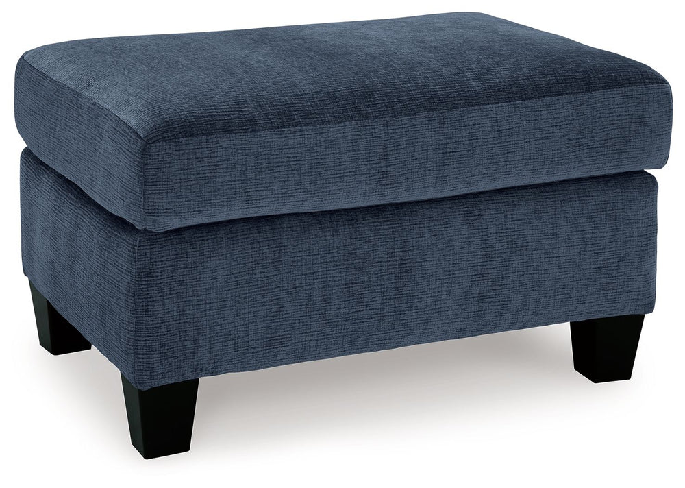 Urban contemporary meets mid century (with a pop of trend-right color) in this ottoman. Supremely soft upholstery, teeming with luster and movement, finesses the piece with just the right touch. Can you think of a better place to throw up your feet in she
