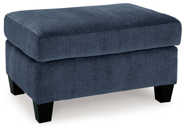 Urban contemporary meets mid century (with a pop of trend-right color) in this ottoman. Supremely soft upholstery, teeming with luster and movement, finesses the piece with just the right touch. Can you think of a better place to throw up your feet in she