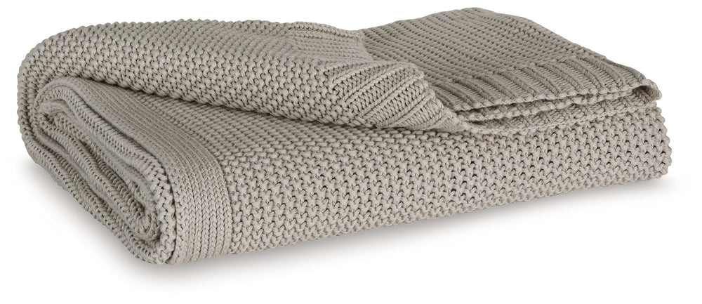 Your place is that much more relaxed and inviting with this cozy throw. Crafted with supreme softness in mind, its neutral hue pairs with a variety of decor. Whether this throw is at the foot of the bed or on the arm of your favorite chair, it-'s wonderfu